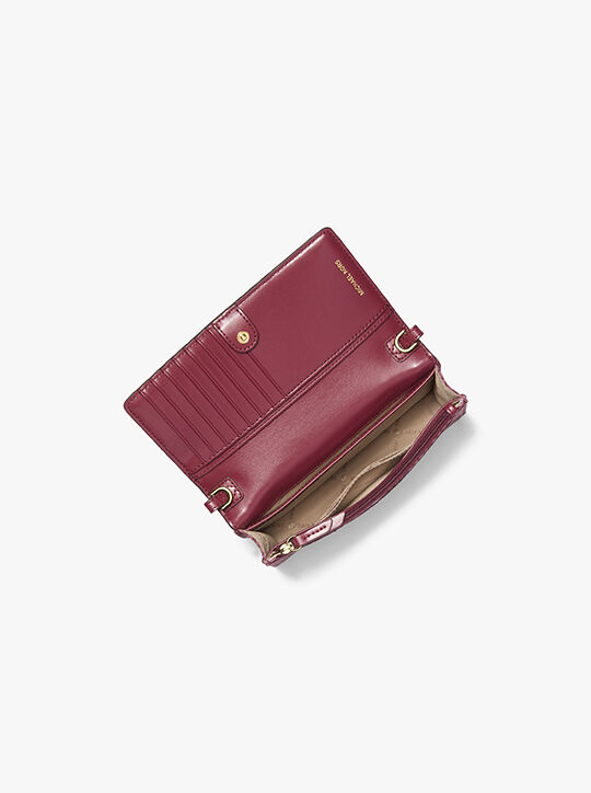 حقيبة كروس جيت سيت منسوجة صغيرة مطبوعة للهواتف الذكية michael kors حقيبة كروس جيت سيت منسوجة صغيرة مطبوعة للهواتف الذكية