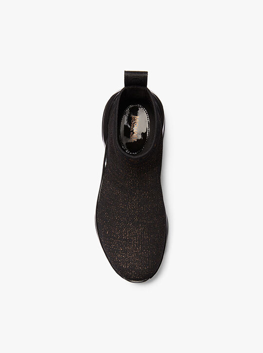 حذاء رياضي أولمبيا بجورب مطاطي ميتاليك إكستريم michael kors حذاء رياضي أولمبيا بجورب مطاطي ميتاليك إكستريم