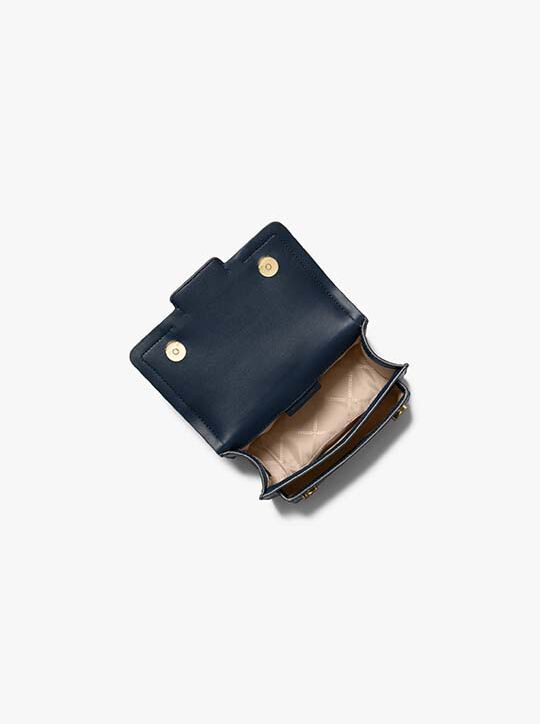 حقيبة كروس هيذر جلدية صغيرة جدًا michael kors حقيبة كروس هيذر جلدية صغيرة جدًا