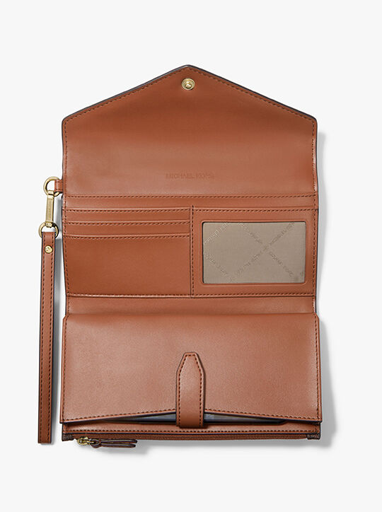 michael kors محفظة جيت سيت معصم على شكل ظرف بشعار الماركة كبير الحجم