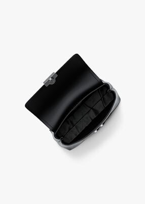 michael kors حقيبة تريبيكا صغيرة جدًا بشعار الماركة