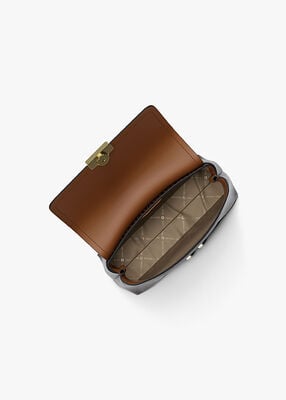 michael kors حقيبة تريبيكا صغيرة جدًا بشعار الماركة