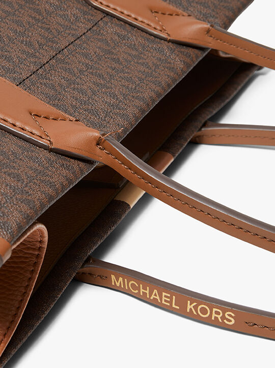 حقيبة يد هايدي كبيرة مخططة بشعار الماركة المميزة michael kors حقيبة يد هايدي كبيرة مخططة بشعار الماركة المميزة