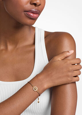 michael kors pav  gold tone logo corded bracelet