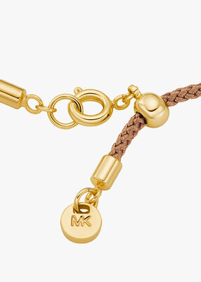 michael kors pav  gold tone logo corded bracelet